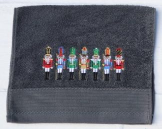 Gastendoekje donkergrijs met zeven notenkrakers op een rij