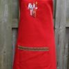 Rood keukenschort met Sint en op de andere kant Merry Christmas