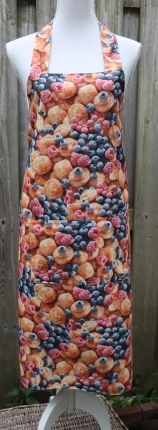 Keukenschort met poffertjes en fruit